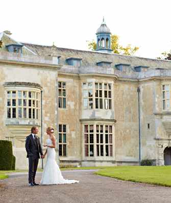 Bride & Groom on driveway outside Hartwell House