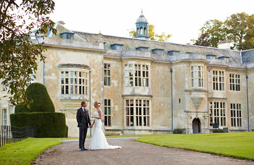 Bride & Groom on driveway outside Hartwell House