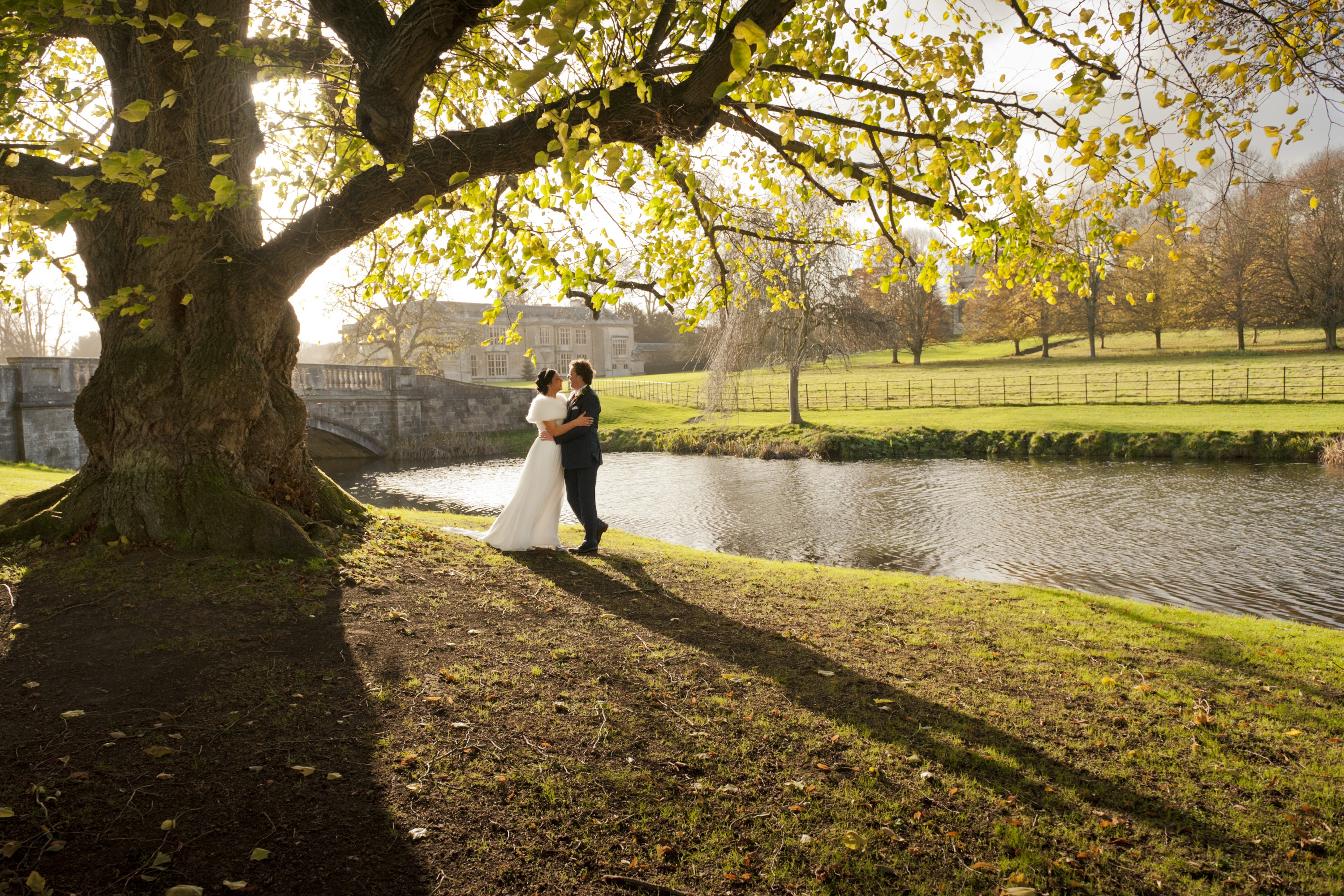 Bridal couple at lakeside in Spring at Hartwell House