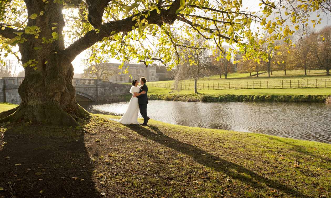 Bridal couple at lakeside in Spring at Hartwell House